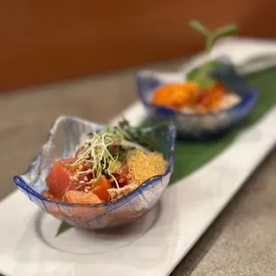 two bowls of food on a plate