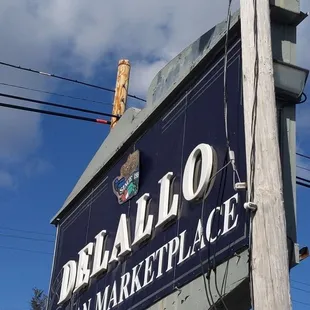 a sign for delallo italian market place