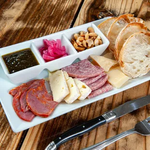 a platter of meat and cheese