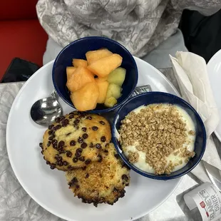 Breakfast with fruits, yogurt, and chocolate chip muffins