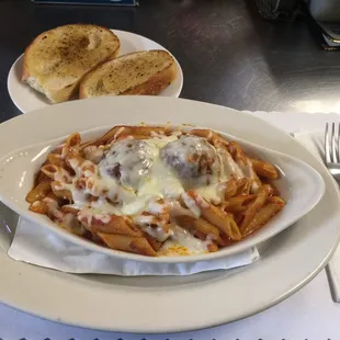a plate of pasta and bread