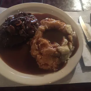 a plate of mashed potatoes and gravy
