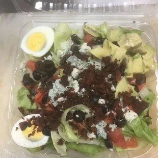 a salad in a plastic container