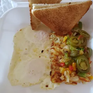 Eggs, hash browns with peppers onions and jalapenos and a side of toast Biscuit and Gravy Breakfast