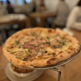 a pizza on a cooling rack