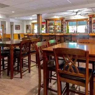 a dining area with a bar