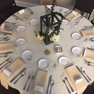 Table set for nine and a high chair during a recent wedding reception at Delaware Country Club.