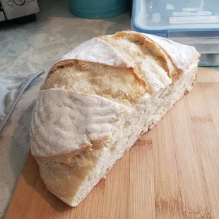 a loaf of bread on a cutting board