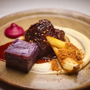 Wagyu short rib with parsnips, Magic Molly pommes Anna, and house-made sauerkraut purée.