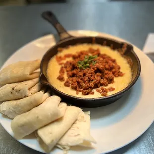 a skillet of food on a table