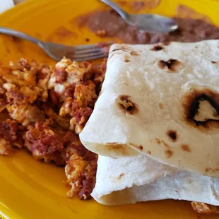 Chorizo eggs, refried beans, and a home-style tortilla to wrap it up