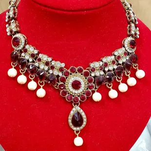 a necklace with pearls and garnetts