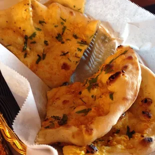 Garlic naan. Light, fluffy with the perfect amount of chewiness. The plain naan is yummy as well.