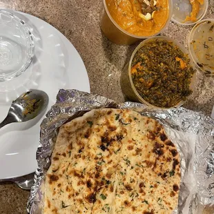 a flatbread pizza on aluminum foil