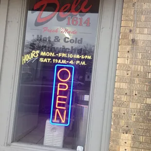 a neon sign in a window