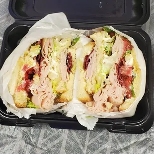 a sandwich in a plastic container