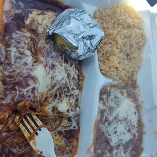 a plastic container with a fork and rice