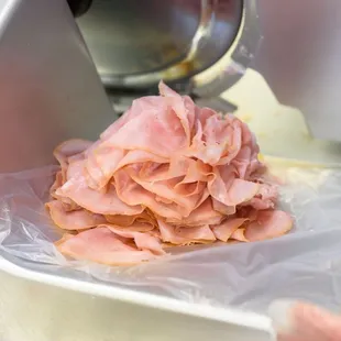 a ham being prepared in a food processor