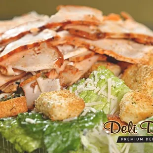 a salad with chicken and croutons