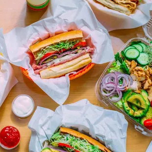 a variety of sandwiches and french fries