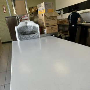 Sandwich and salad being prepared.