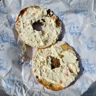 Open Onion Bialy with pickled veggies cream cheese.