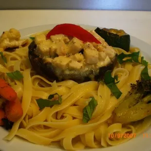 a plate of pasta and vegetables