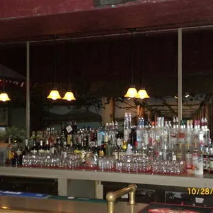 a bar filled with liquor bottles