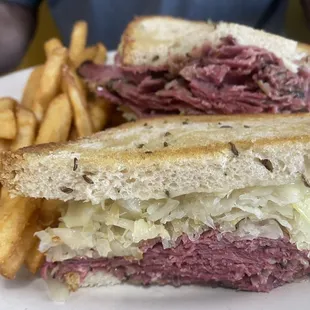 a corned beef sandwich and french fries