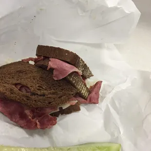 Pastrami and swiss on dark rye bread