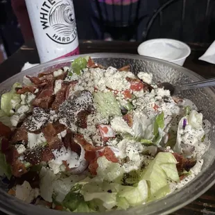 Bacon, blue cheese salad with ranch dressing.