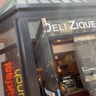 the entrance to the deli zique restaurant