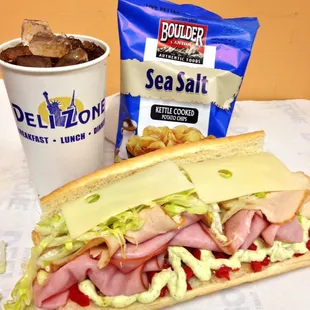 a sub sandwich and a drink