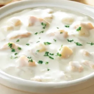 a bowl of soup with bread
