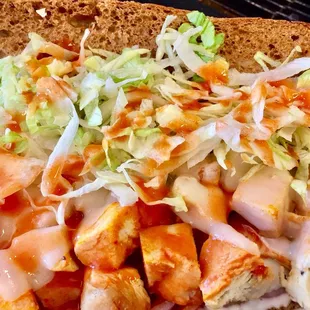 a chicken sandwich with coleslaw
