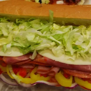 Italian Hero with Ham, Salami, Pepperoni, Provolone,Tomato, Red Pepper, Banana Pepper, Red onion, Lettuce, Oil &amp; Vinegar on french bread