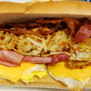 Home of the Kong. The breakfast sandwich comes with Bacon, Ham, fried Eggs, Cheese, and Hashbrowns served on our signature french bread.