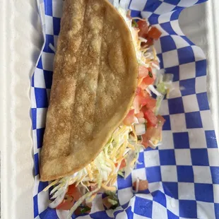 Ground beef taco delish with pico, cheese, lettuce and sour cream