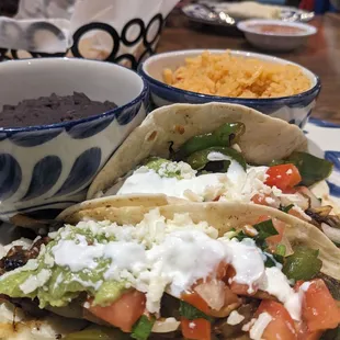 Veggie tacos with black beans and rice.