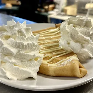 Lemon curd crepe with homemade Chantilly. Zesty meets sweet in every bite!