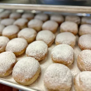 Mini beignets filled with red fruit jam: Sweet, fluffy, and bursting with flavor!