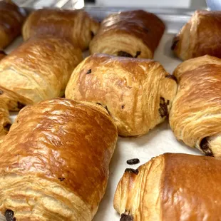 Butter chocolate croissant: Flaky, buttery layers meet rich chocolate. Indulgence in every bite!