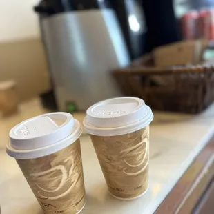 two cups of coffee on a counter