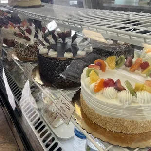 a variety of cakes on display