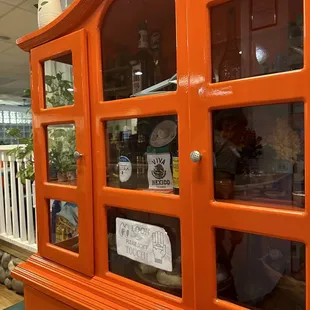 an orange china cabinet