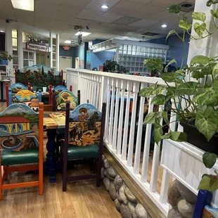 a dining area with tables and chairs