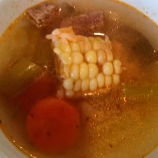 A little bowl of caldo de res comes with your meal at Delicias Cafe