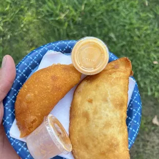 Left. Chicken and potato empanada. Right chorizo and cheese empanada.  $9 for the two.