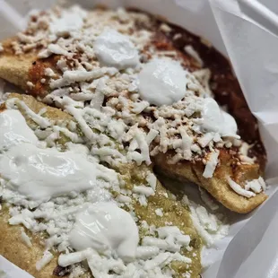 Cheese empanada with green sauce and chicken empanada with red sauce