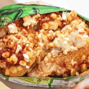 a hand holding a burrito